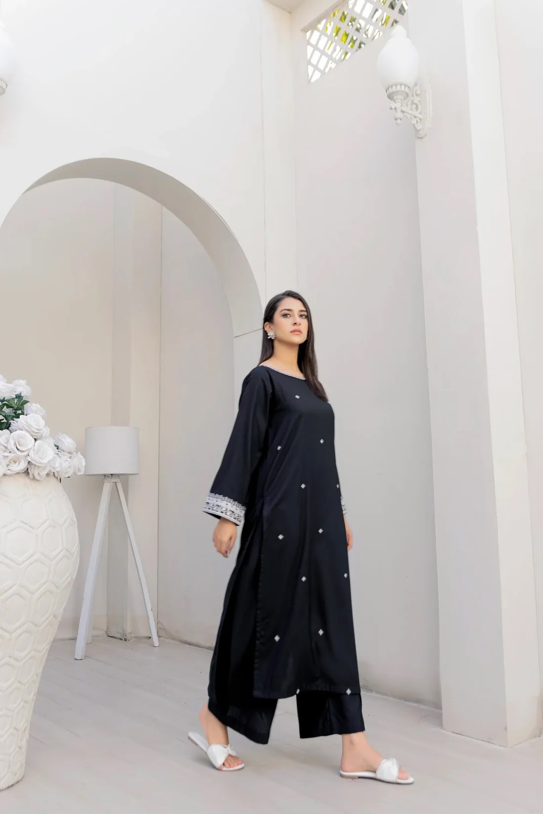 Black embroidered outfit, full-length editorial